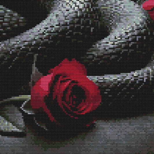 Gothic snake cross stitch pattern with a dark serpent design, red roses, and bold moody embroidery style.