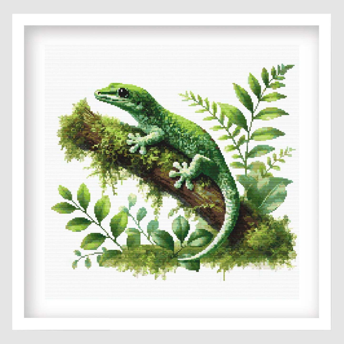 Green Gecko Cross Stitch Pattern featuring a bright green lizard resting on a mossy branch with tropical leaves and natural wildlife detail.