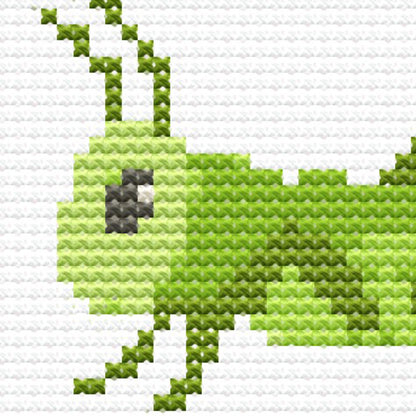 Close-up of Insect Cross Stitch Pattern Set showing a green grasshopper design with bright colour and playful bug detail.