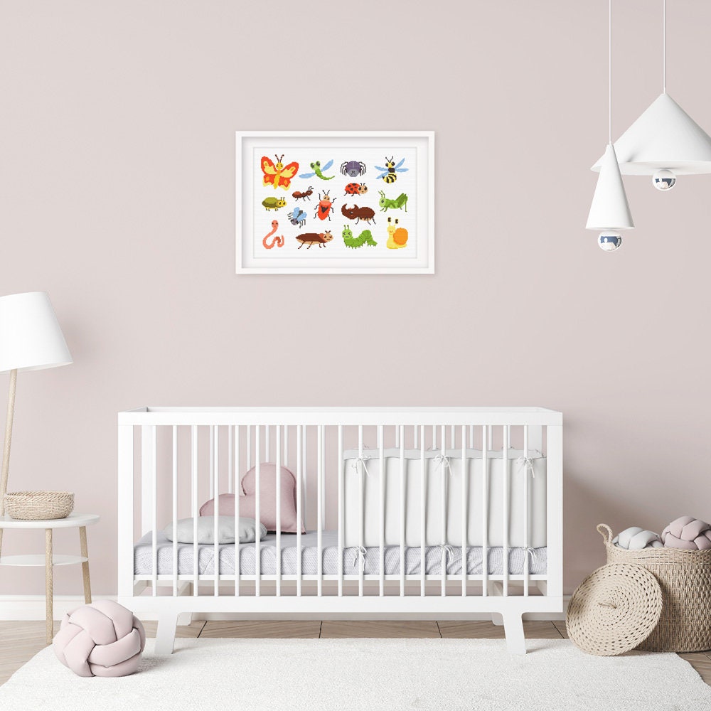 Insect Cross Stitch Pattern Set shown in a nursery room preview as colourful bug wall art above a cot.