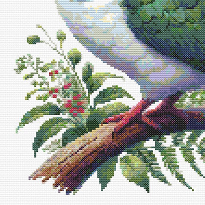 Close-up of New Zealand Kererū Cross Stitch Pattern showing the wood pigeon perched on a branch with fern leaves, berries, and native bird detail.