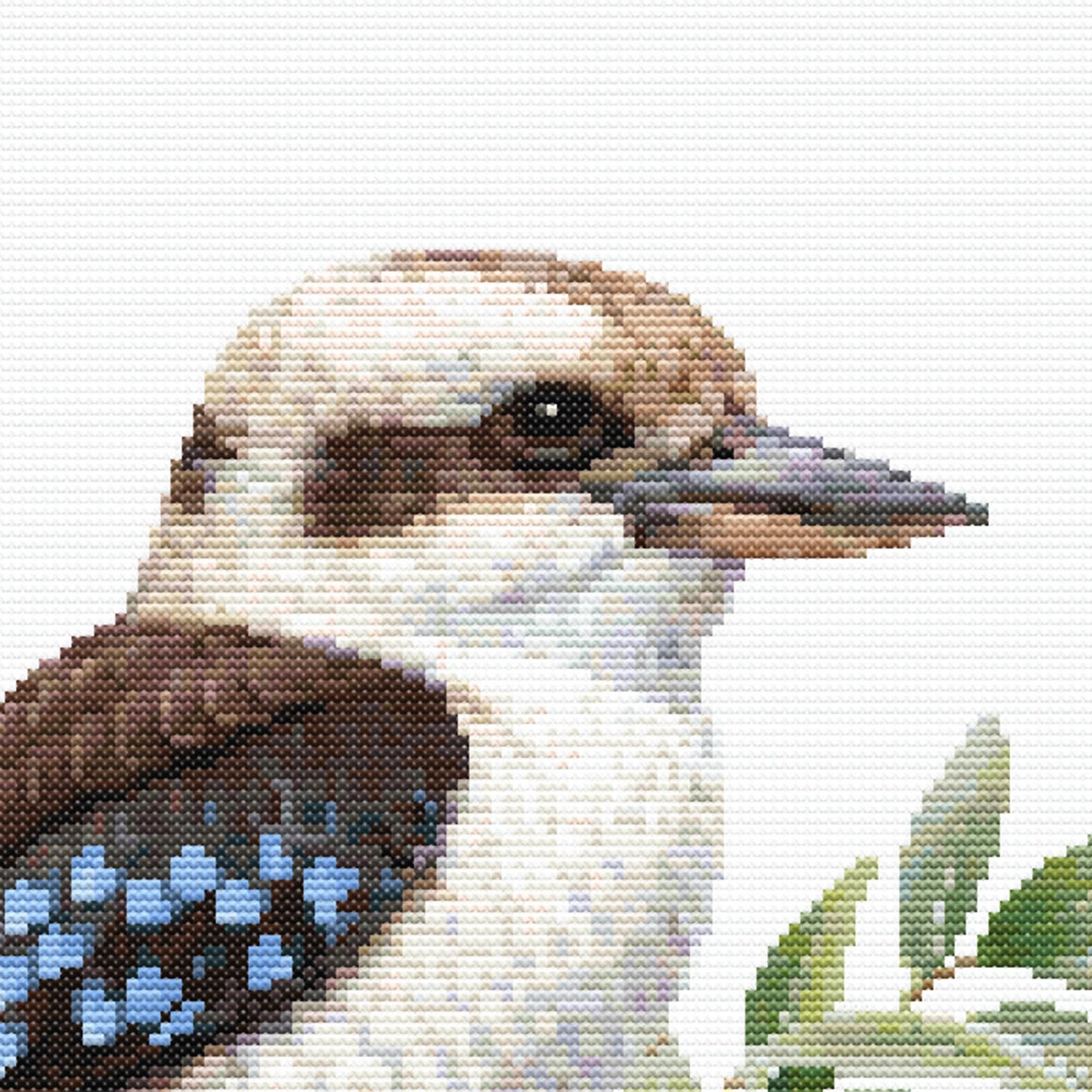 Close-up of Kookaburra Cross Stitch Pattern showing the bird’s face, beak, feather markings, eucalyptus leaves, and visible counted cross stitch texture.