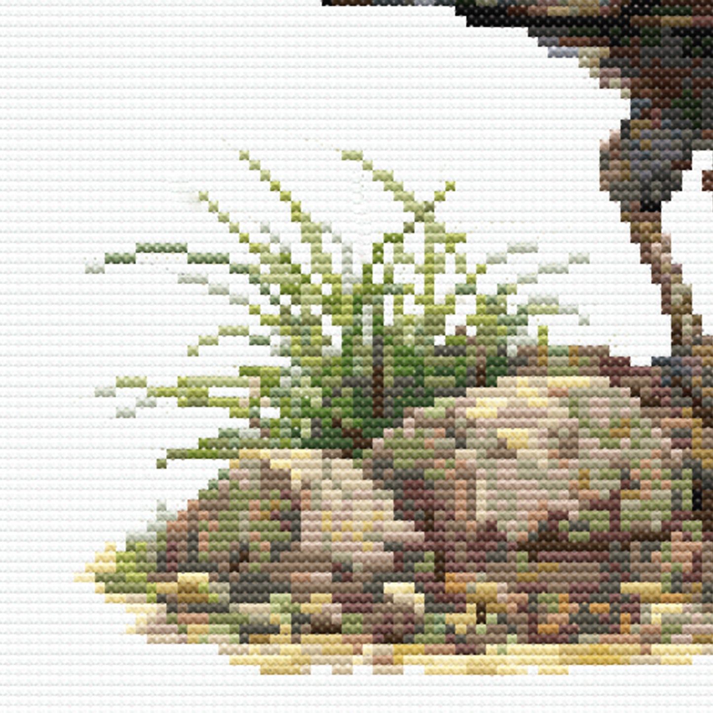 Detailed close-up of the cross stitch pattern highlighting native grasses, rocks, and the lyrebird's legs and surrounding ground.