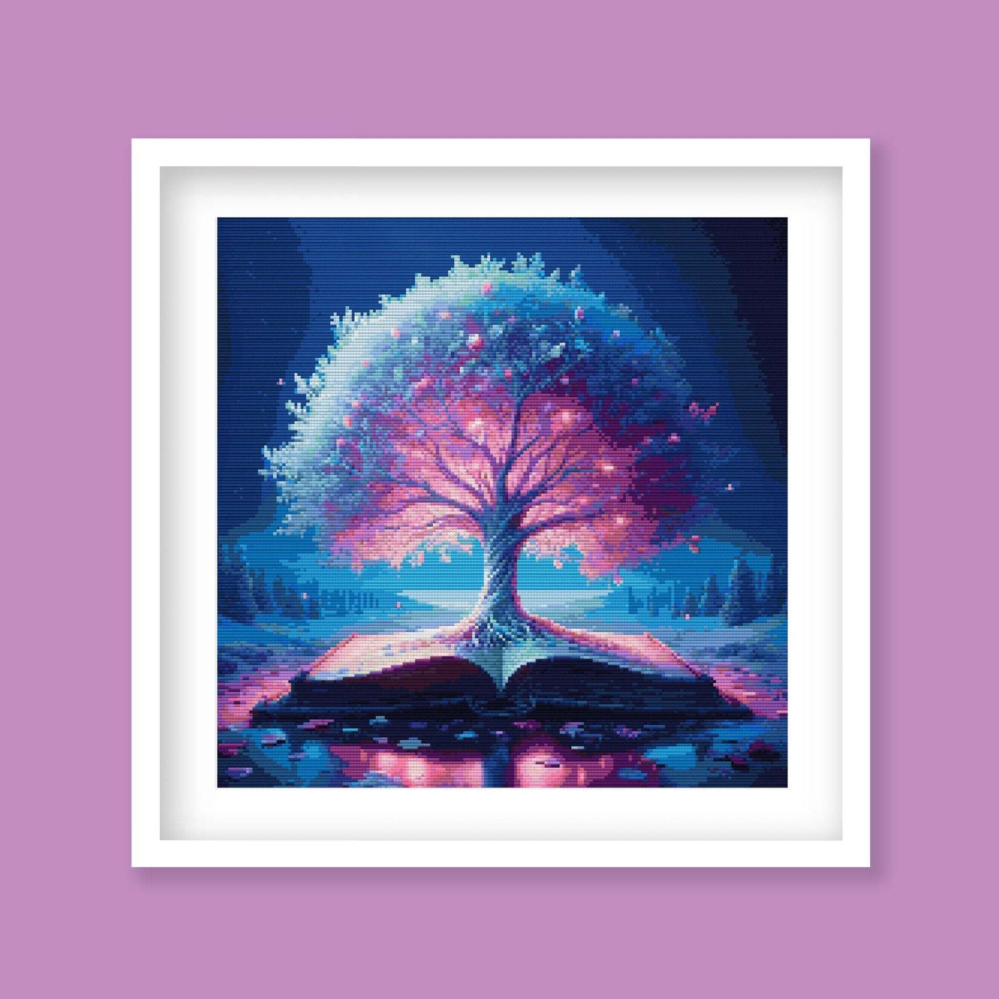 Magic Book Cross Stitch Pattern displayed as framed wall art with a glowing tree, open book, moonlit sky, and fantasy storybook atmosphere.