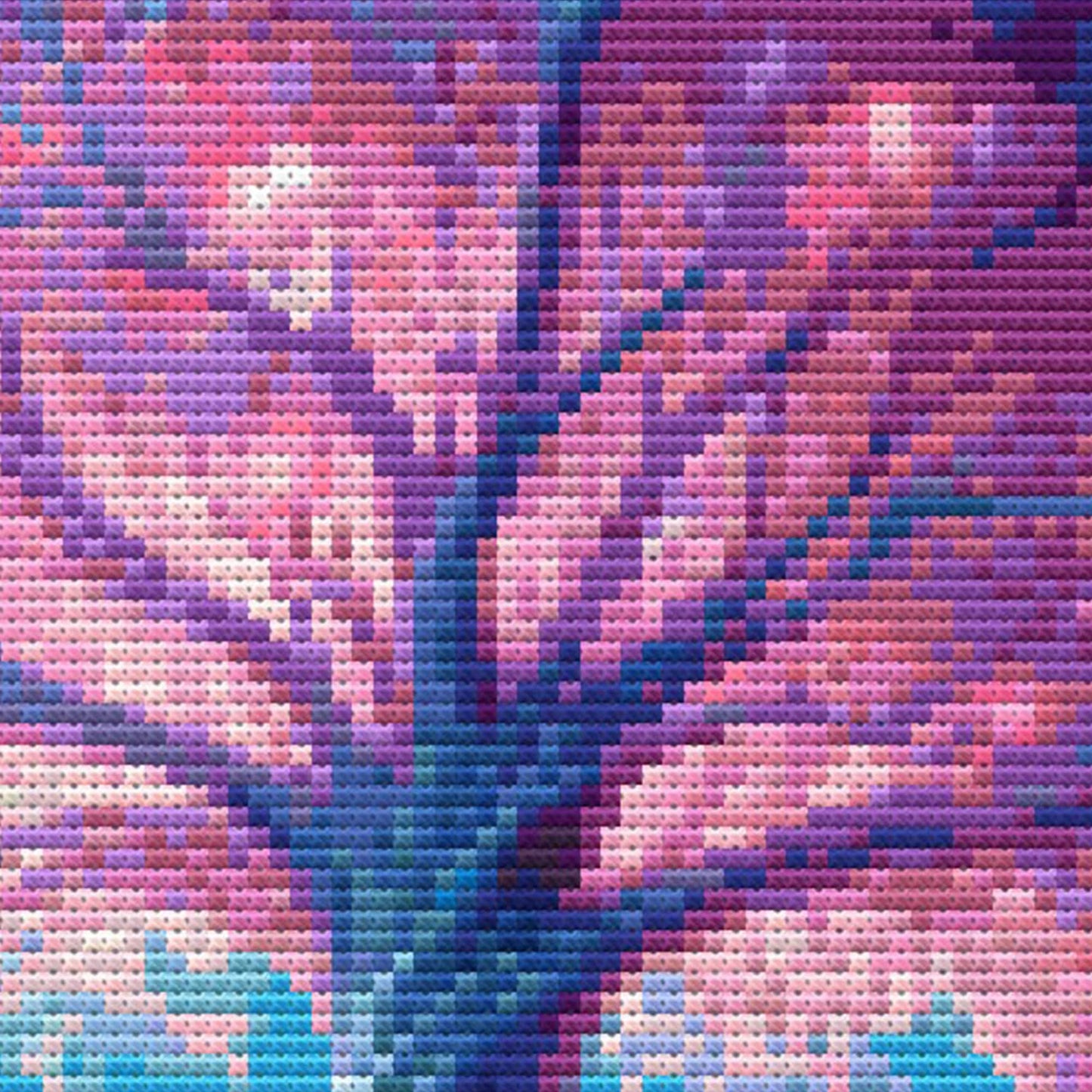 Close-up of Magic Book Cross Stitch Pattern showing a glowing magical tree, pink and blue branches, night sky detail, and visible counted cross stitch texture.