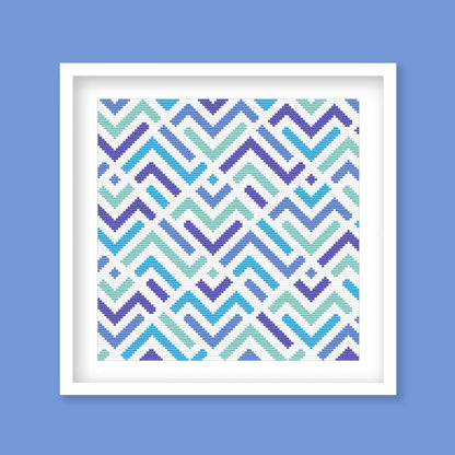 Modern Geometric ZigZag Cross Stitch Pattern displayed in a blue frame with a bright abstract zigzag design for modern wall art.
