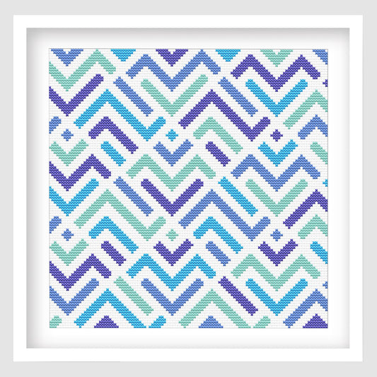 Modern Geometric ZigZag Cross Stitch Pattern displayed as framed wall art with blue, teal, and purple zigzag lines in a clean modern design.