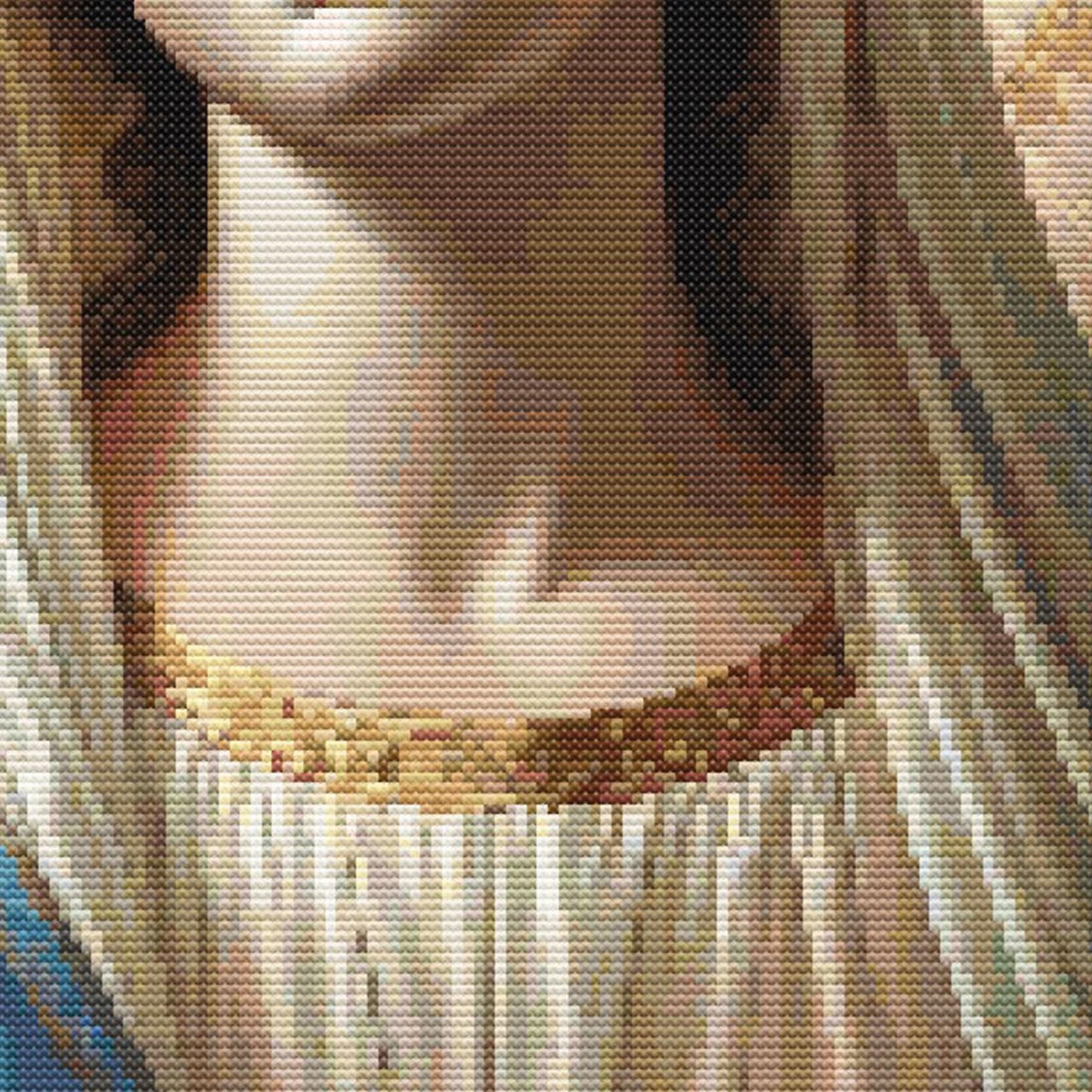 Close-up of Virgin Mary Cross Stitch Pattern showing robe detail, soft fabric shading, warm halo tones, and visible counted cross stitch texture.