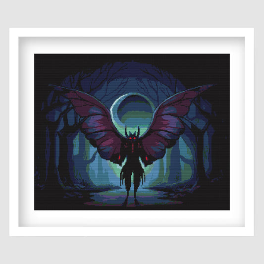 Mothman Cross Stitch Pattern displayed as framed gothic wall art with a dark winged mothman figure, glowing eyes, moonlit forest, and eerie blue lighting.