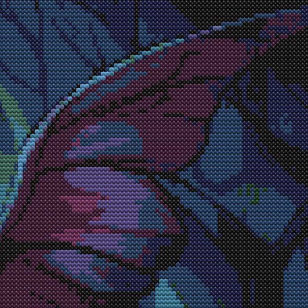 Close-up of Mothman Cross Stitch Pattern showing purple wing shading, dark gothic colours, and detailed stitch texture.