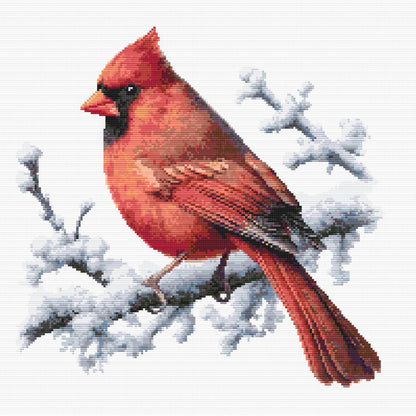Northern Cardinal Bird Cross Stitch Pattern featuring a bright red cardinal perched on snow-covered branches in a winter wildlife design.