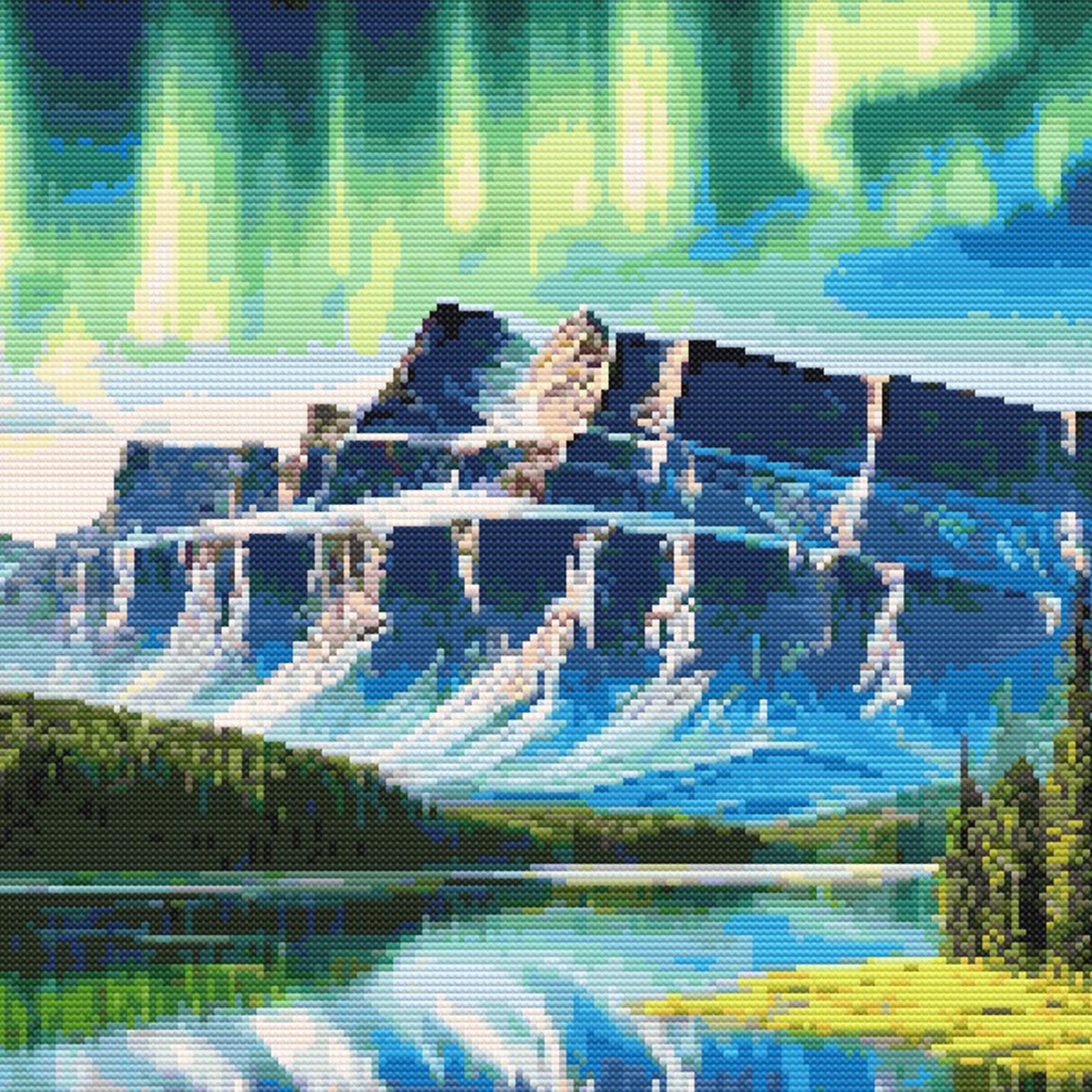 Moose cross stitch pattern featuring a mountain lake landscape, glowing northern lights, snowy peaks, pine forest, and bright nature-inspired scenery.
