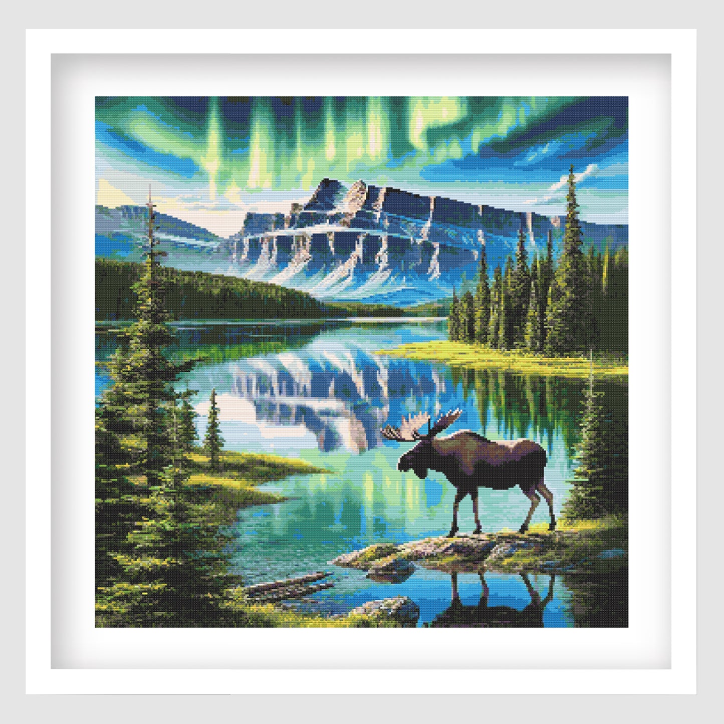 Majestic moose under northern lights cross stitch pattern featuring a moose beside a mountain lake with aurora sky and forest scenery.
