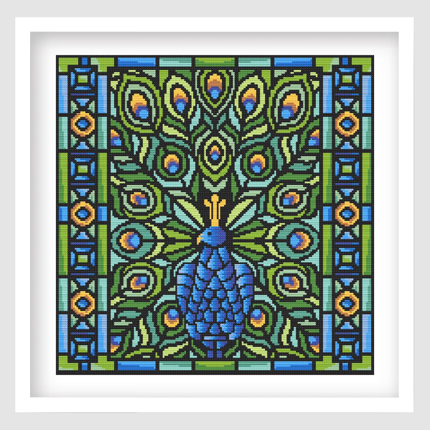 Peacock Mosaic Cross Stitch Pattern displayed as framed wall art with a blue peacock, jewel-tone feathers, bold black outlines, and stained glass-inspired detail.