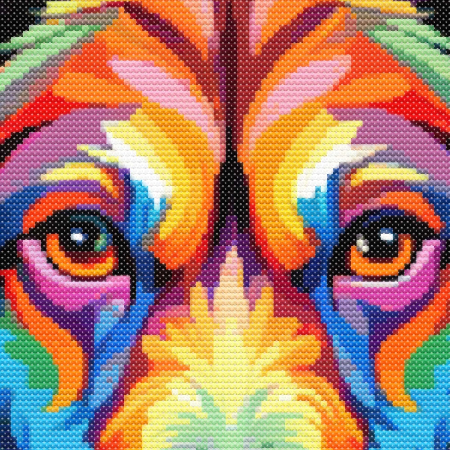 Close-up of Rainbow Golden Retriever Dog Cross Stitch Pattern showing the dog face, bright rainbow colours, and visible counted cross stitch texture.