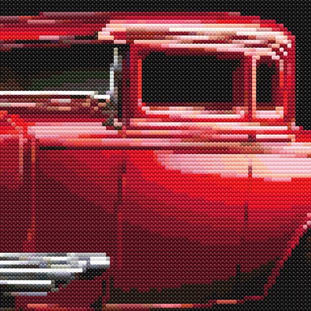 Close-up of Red Hot Rod Cross Stitch Pattern showing deep red paintwork, classic car door detail, chrome highlights, and visible counted cross stitch texture.