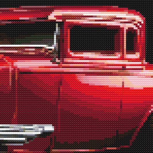 Close-up of Red Hot Rod Cross Stitch Pattern showing deep red paintwork, classic car door detail, chrome highlights, and visible counted cross stitch texture.