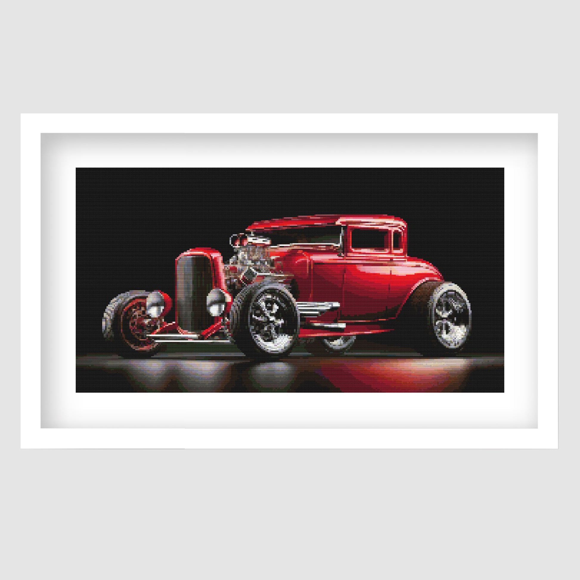 Red Hot Rod Cross Stitch Pattern displayed as framed wall art with a glossy red classic car, black background, chrome detail, and retro automotive styling.