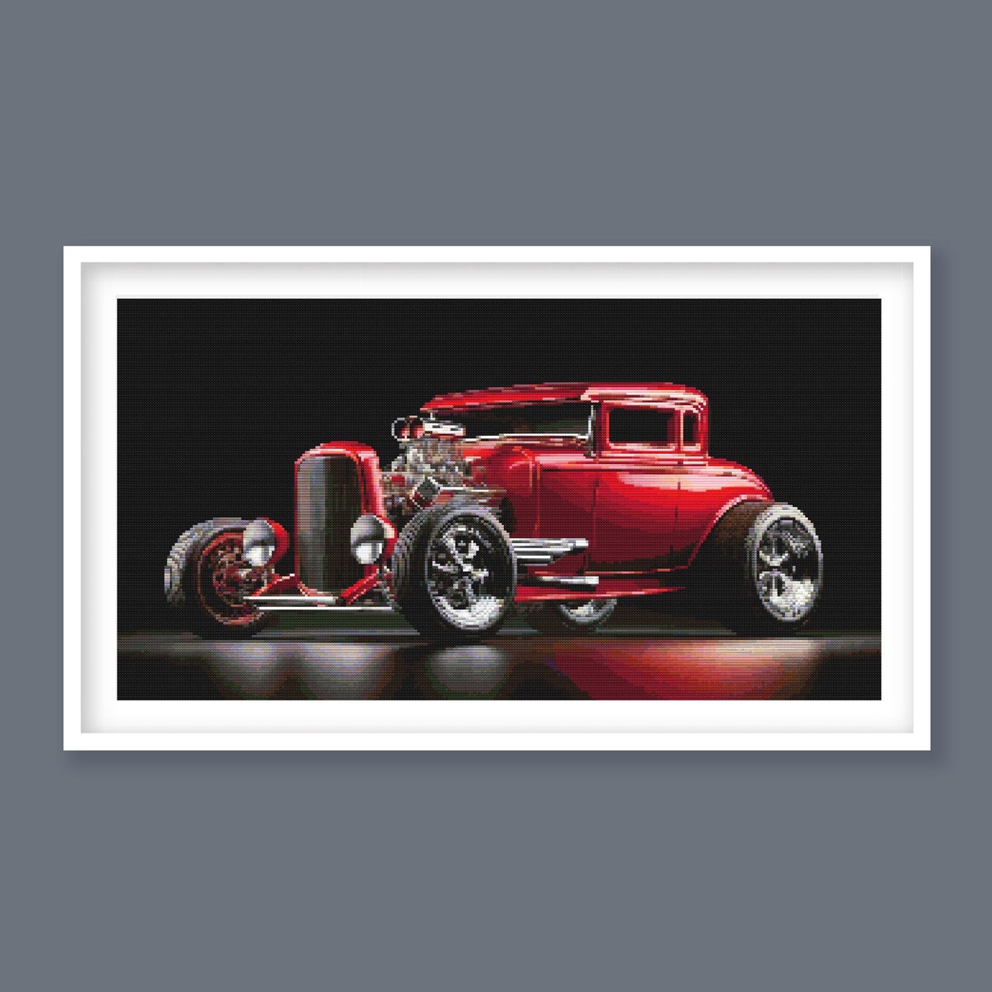 Red Hot Rod Cross Stitch Pattern displayed in a white frame as retro car wall art with a red hot rod and black background.