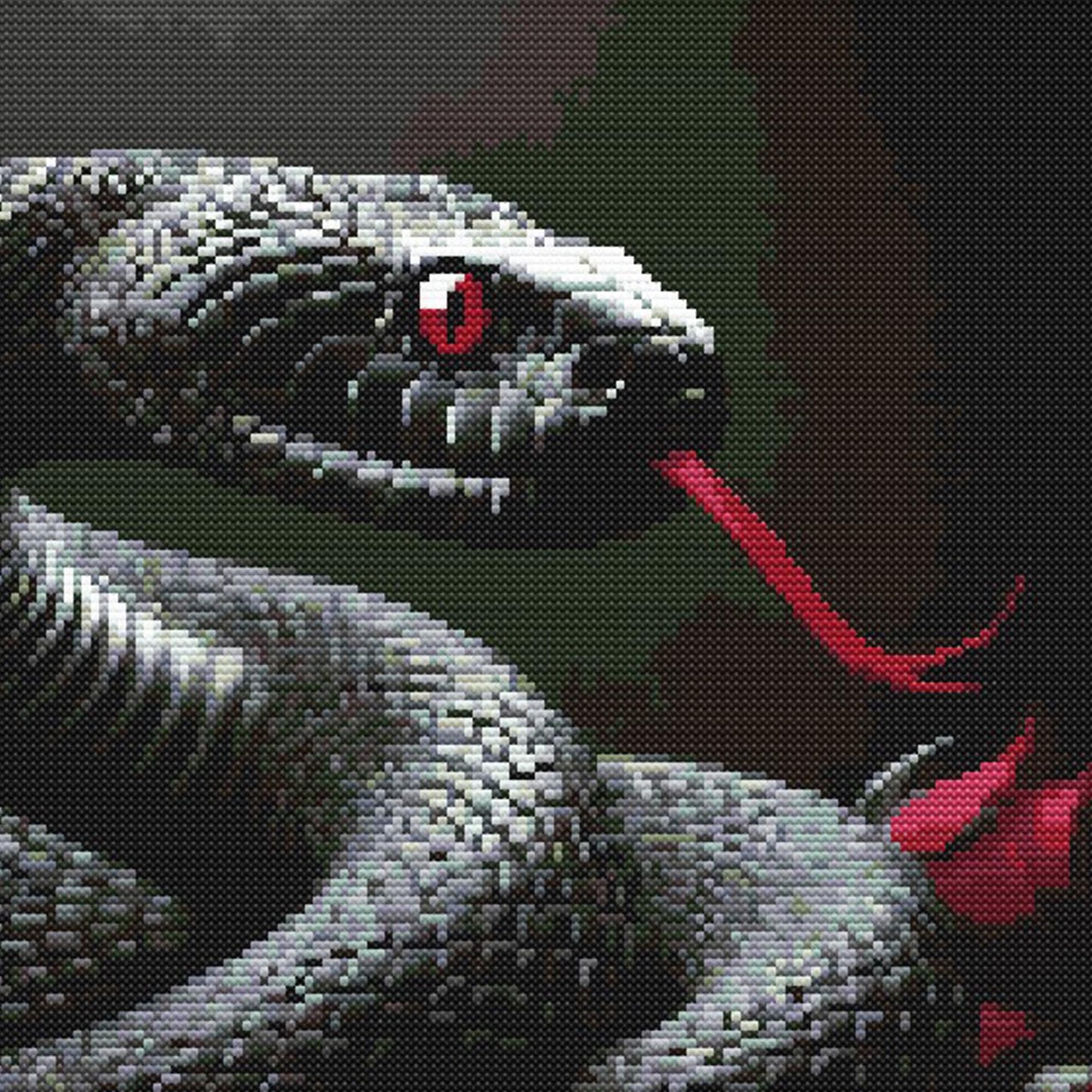 Close-up of snake and roses cross stitch pattern showing detailed serpent scales, red eyes, and rich gothic colours.