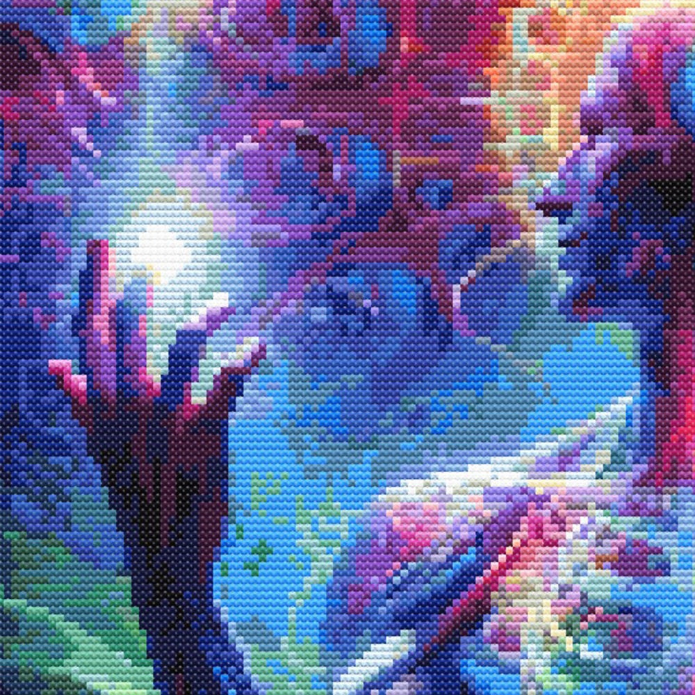 Close-up of Spiritual Enlightenment Cross Stitch Pattern showing a raised hand, glowing colour effects, abstract background, and visible counted cross stitch texture.