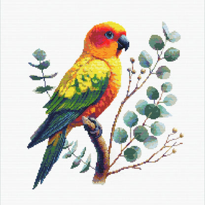Sun Conure Cross Stitch Pattern featuring a colourful rainbow parrot perched with leafy branches and tropical bird detail.