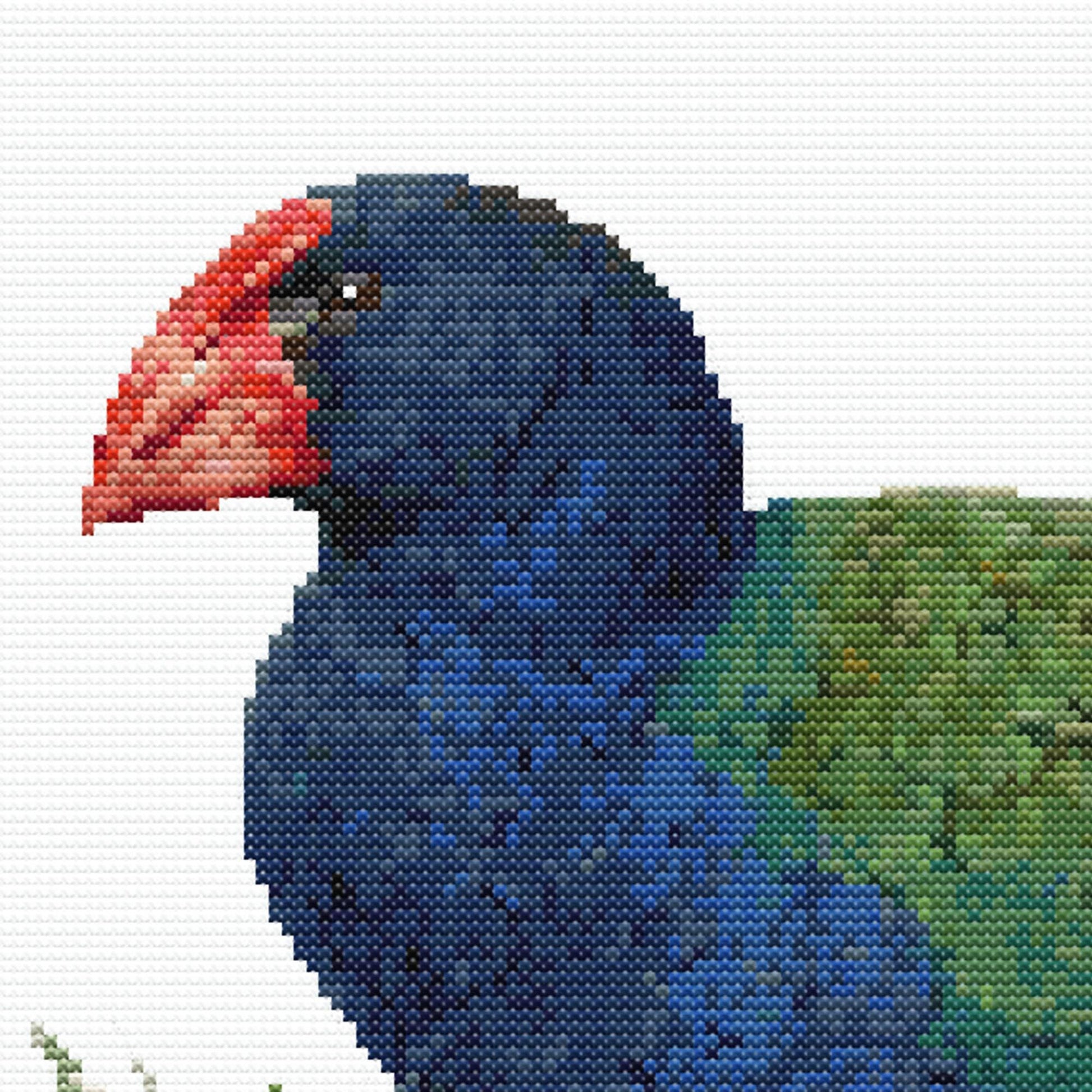 Close-up of Takahē Cross Stitch Pattern showing the red beak, blue head, green feather detail, and visible counted cross stitch texture.