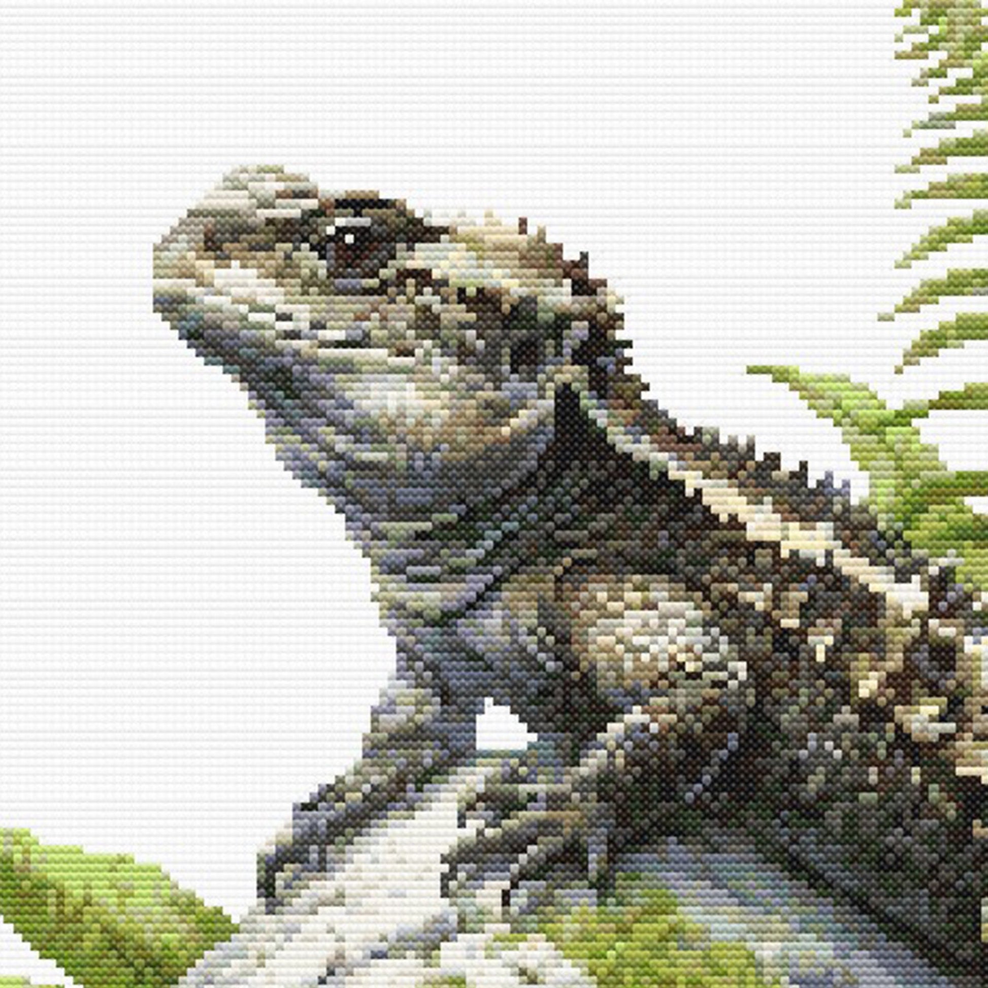 Close-up of Tuatara Cross Stitch Pattern showing the tuatara head, textured scales, fern detail, and visible counted cross stitch texture.