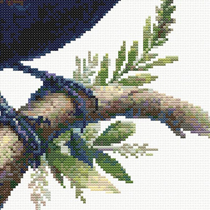 Close-up of New Zealand Tui Cross Stitch Pattern showing the tui perched on a branch with fern detail and natural New Zealand bird styling.