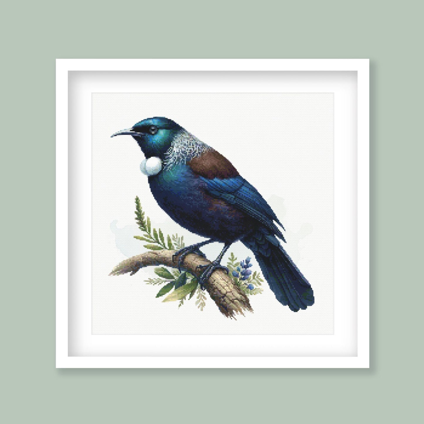 Tui Cross Stitch Pattern displayed in a green frame with native New Zealand bird artwork and natural branch detail.