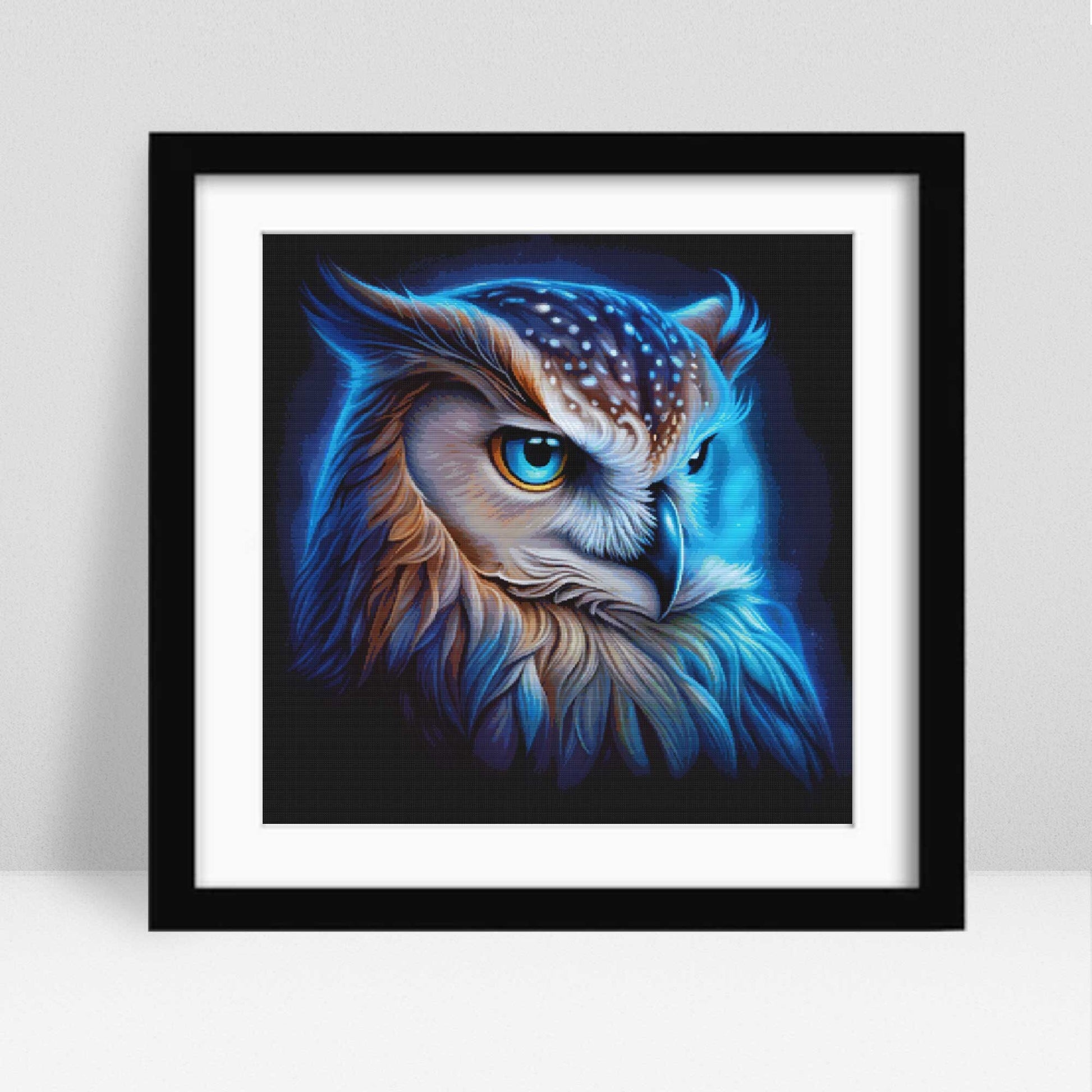 Framed artwork of a colorful owl on a white background