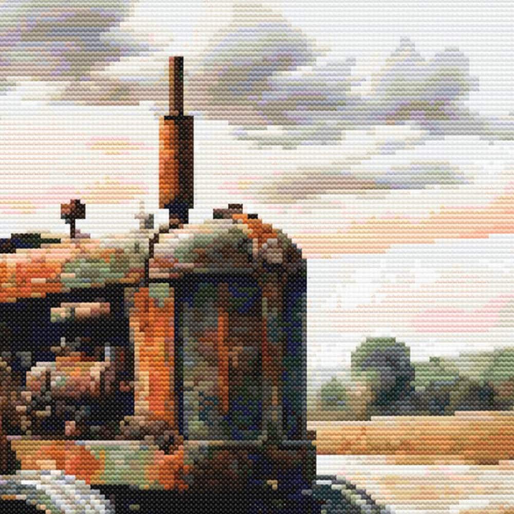 Close-up of Vintage Farm Tractor Cross Stitch Pattern featuring the front of an old farm tractor with soft sky and rural background.