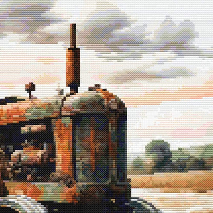 Close-up of Vintage Farm Tractor Cross Stitch Pattern featuring the front of an old farm tractor with soft sky and rural background.