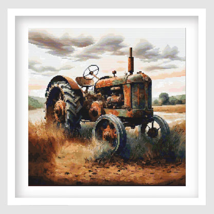 Vintage Farm Tractor Cross Stitch Pattern displayed as framed wall art with an old rusty tractor, rural field, and farmhouse landscape detail.