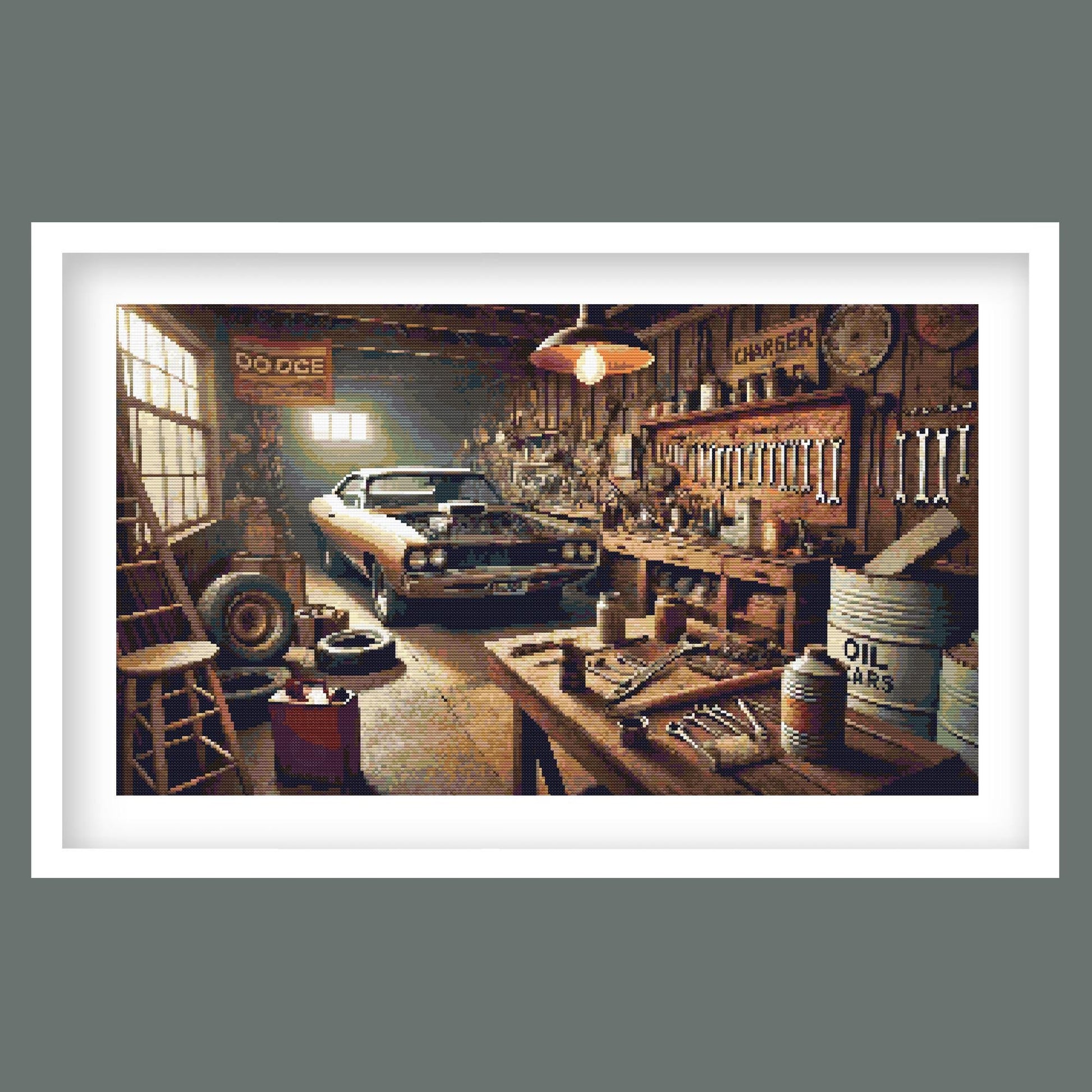 Vintage Muscle Car Garage Cross Stitch Pattern displayed in a black frame as retro vehicle wall art with a classic car and workshop setting.