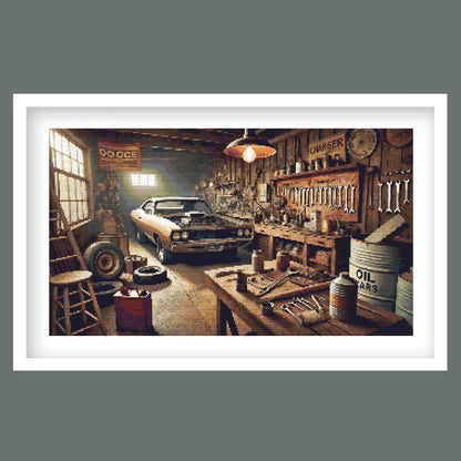 Vintage Muscle Car Garage Cross Stitch Pattern displayed in a black frame as retro vehicle wall art with a classic car and workshop setting.