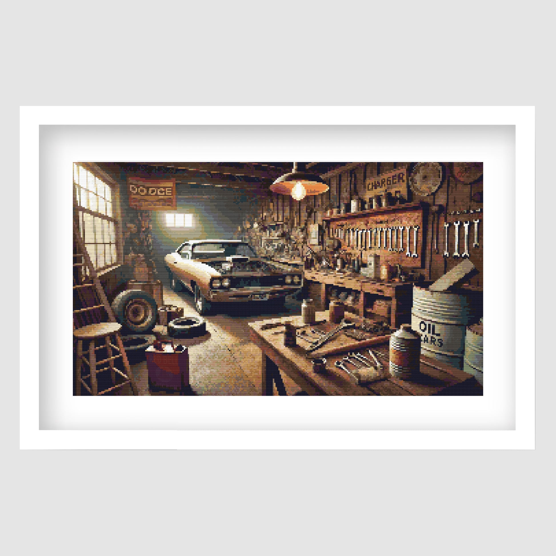 Vintage Muscle Car Garage Cross Stitch Pattern displayed as framed wall art with a classic muscle car, workshop tools, warm lighting, and retro garage detail.