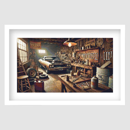 Vintage Muscle Car Garage Cross Stitch Pattern displayed as framed wall art with a classic muscle car, workshop tools, warm lighting, and retro garage detail.
