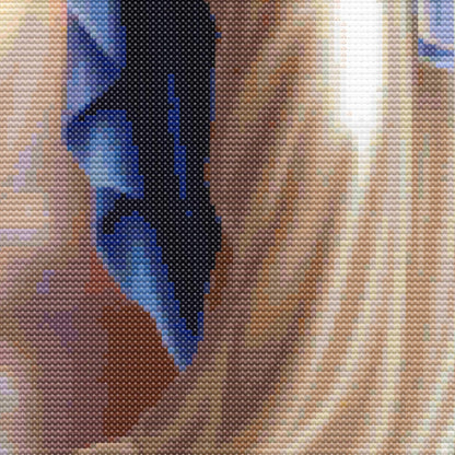 Detailed close-up of Virgin Mary cross stitch pattern with visible fabric texture, soft shading, and sacred art detail.