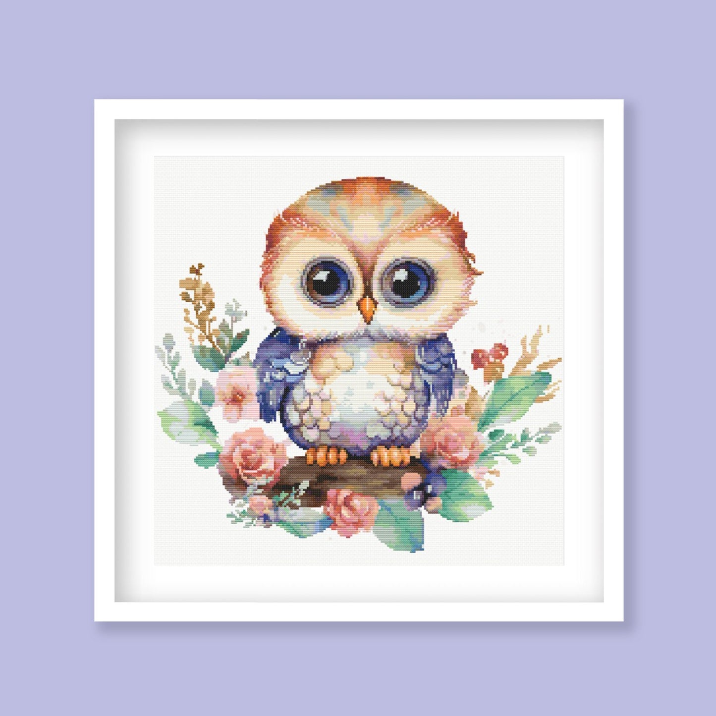 Whimsical Owl Cross Stitch Pattern displayed as framed wall art with a cute owl, floral detail, soft colours, and nursery-style decor.