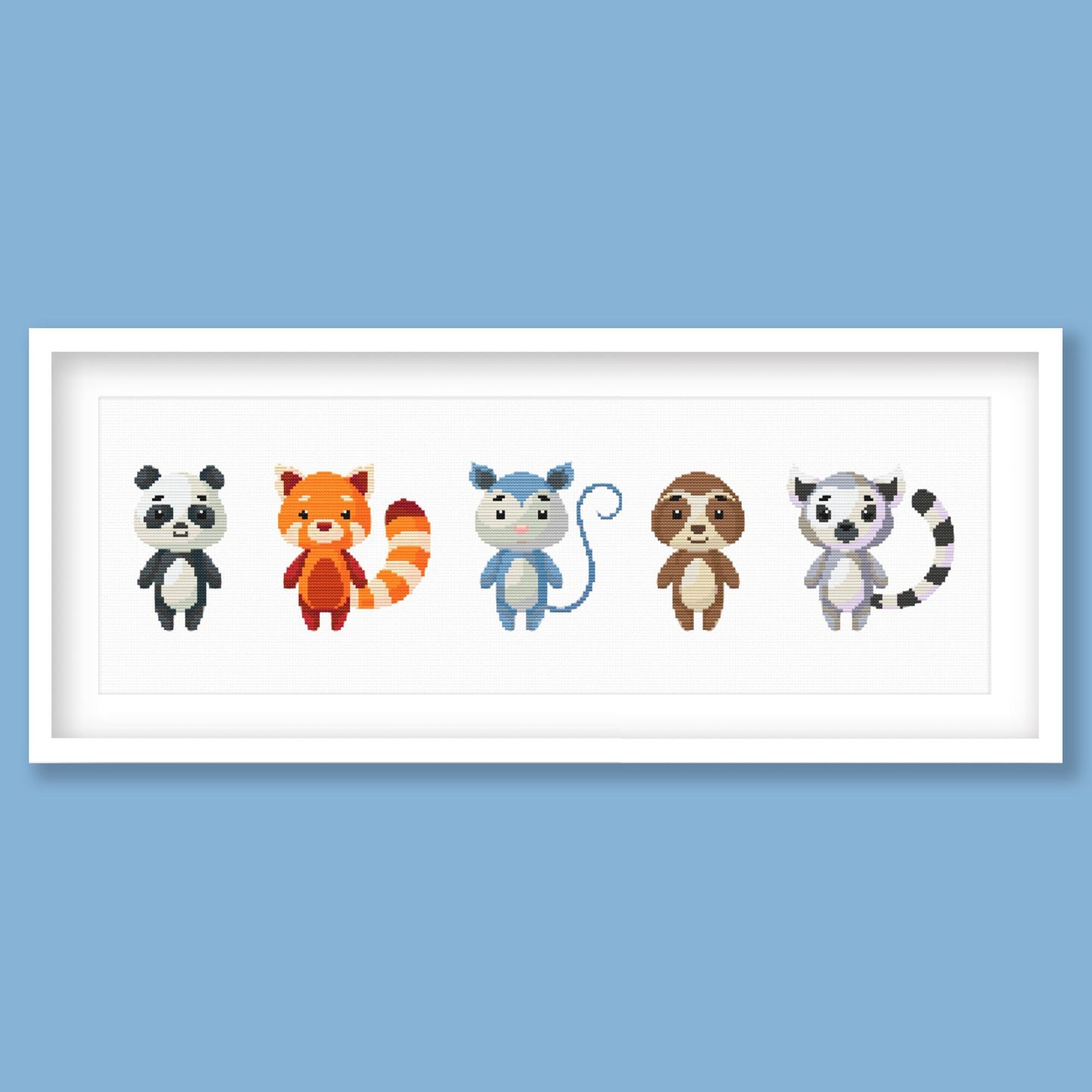 Cute Woodland Animal Cross Stitch Pattern displayed in a blue frame with a row of colourful animal characters for children’s room decor.